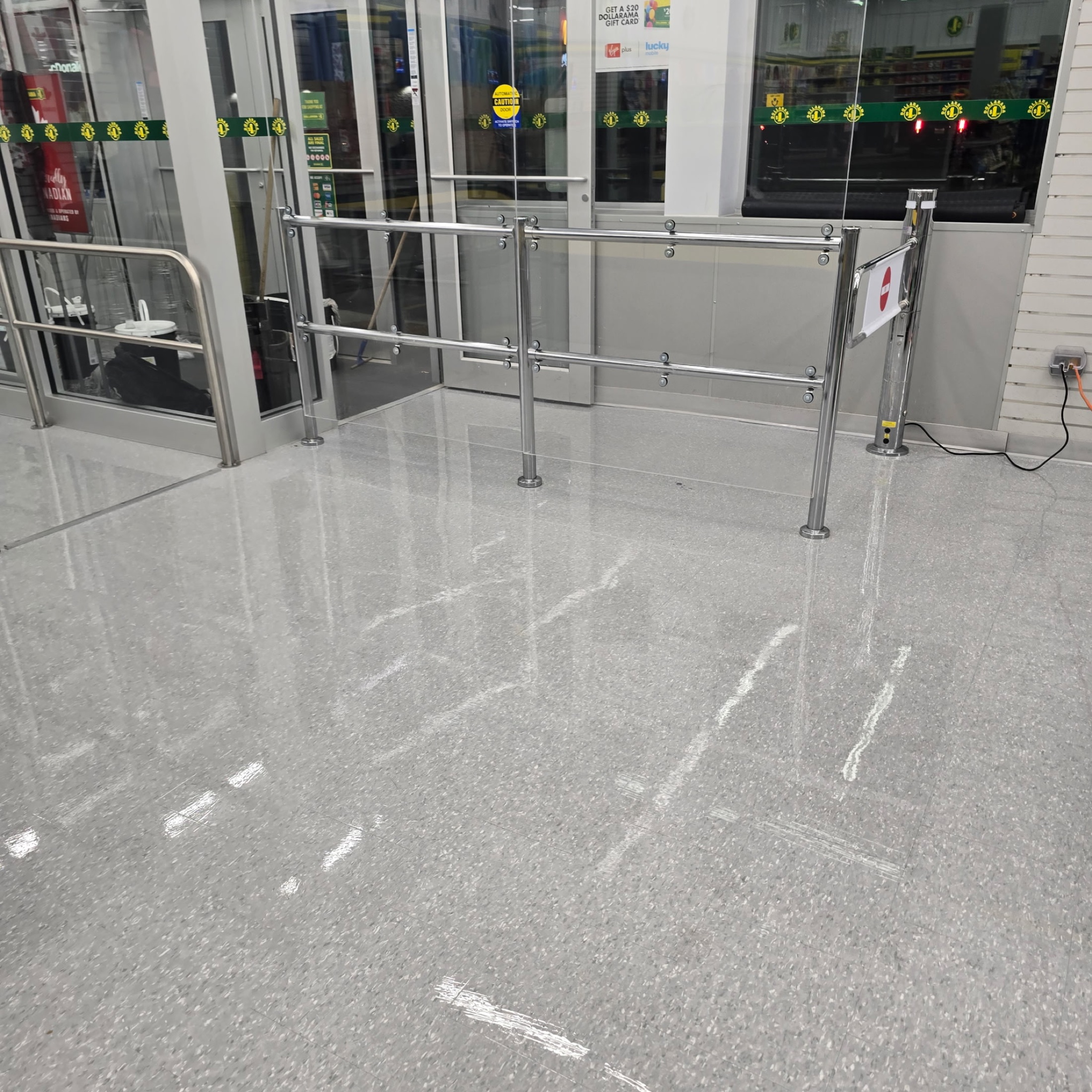 Recently serviced Dollarama entrance and customer queue flooring